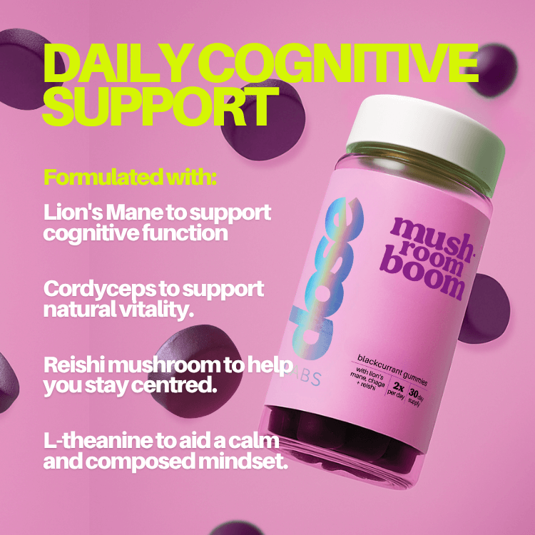 Stack of purple capsules with text about ingredients on a white background
