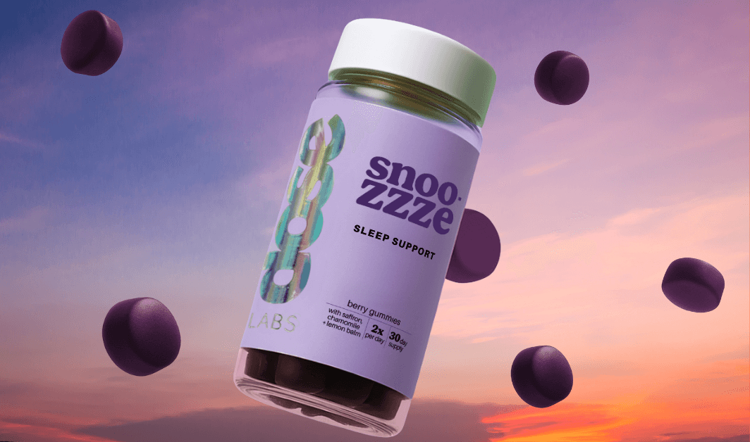 Snooze Zzzze sleep support supplement bottles with purple capsules on a light blue background