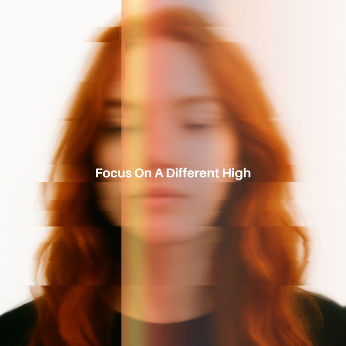 Women with red hair stands with her eyes half open, she is blured and glitching as if on a tv