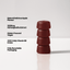 Stack of 4 redish brown ashwagamdha gummies on a white backdrop with text
