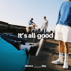 Group of people on a rooftop with bicycles, text overlay 'It's all good. Have a ___ day'.
