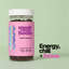 Jar of 'mushroom boom' gummies with pink label on a light green background