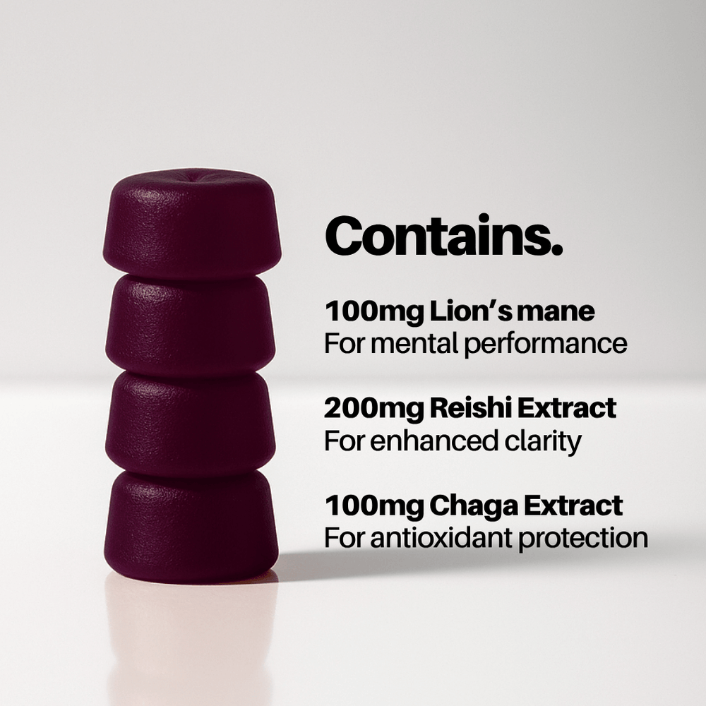 Stack of purple capsules with text about ingredients on a white background