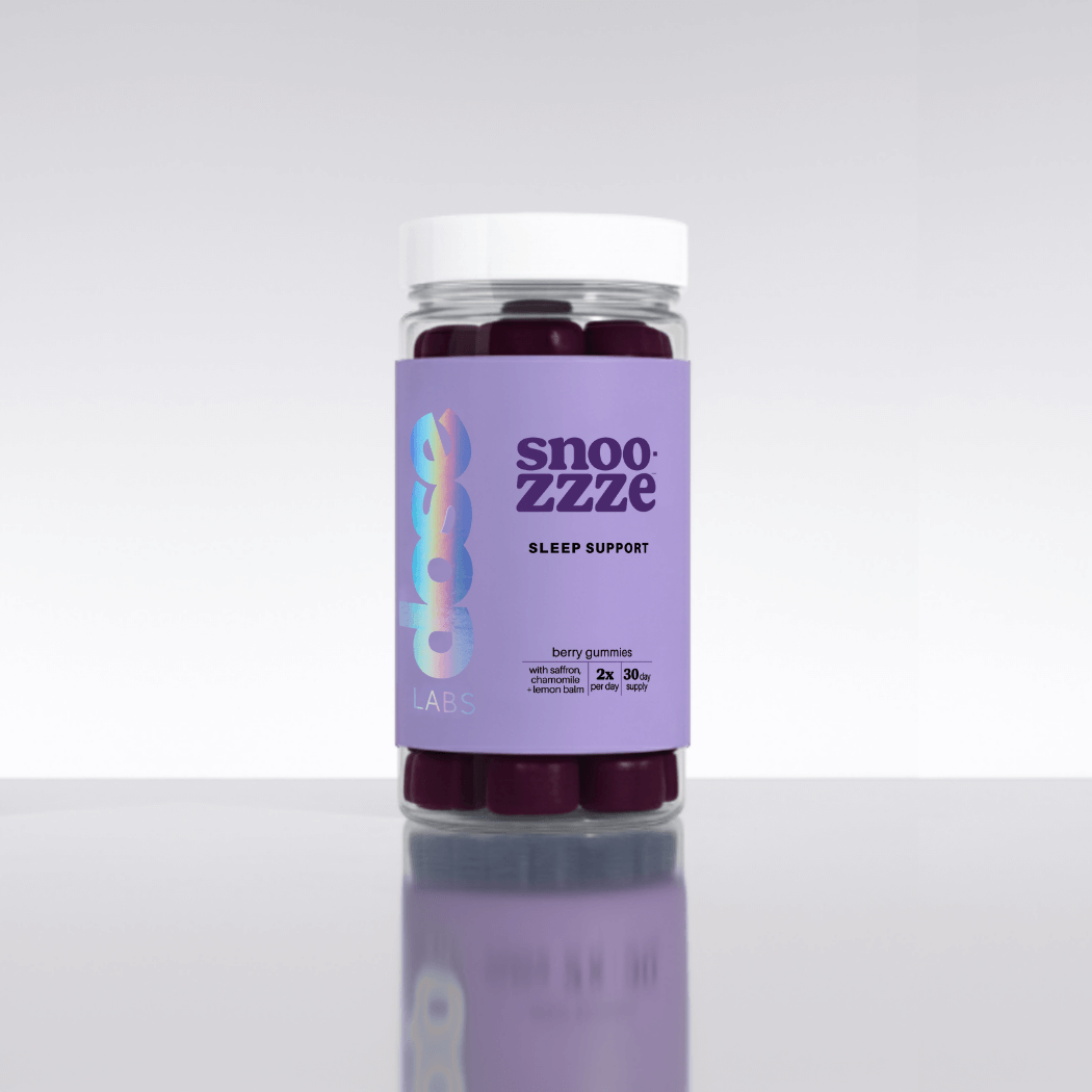 Jar of snooze sleep support gummies on a white background